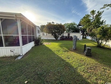This cozy 2 bed, 1 bath furnished mobile home in the Waterway on Barefoot Resort and Golf Club  in South Carolina - for sale on GolfHomes.com, golf home, golf lot