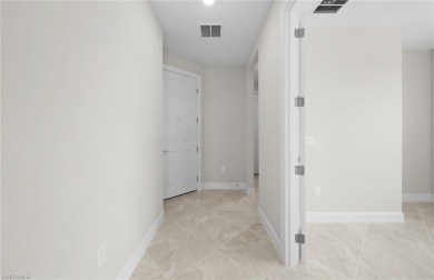 Enjoy low-maintenance, resort-style living in this beautifully on River Hall Country Club in Florida - for sale on GolfHomes.com, golf home, golf lot
