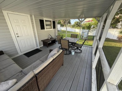 This cozy 2 bed, 1 bath furnished mobile home in the Waterway on Barefoot Resort and Golf Club  in South Carolina - for sale on GolfHomes.com, golf home, golf lot