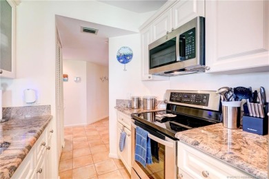 Enjoy breathtaking panoramic views of the golf course and lake on Ocean Club At the Hutchinson Island Beach Resort in Florida - for sale on GolfHomes.com, golf home, golf lot