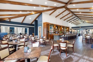Enjoy low-maintenance, resort-style living in this beautifully on River Hall Country Club in Florida - for sale on GolfHomes.com, golf home, golf lot