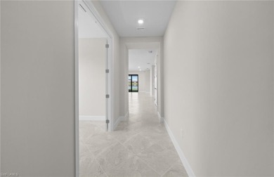 Enjoy low-maintenance, resort-style living in this beautifully on River Hall Country Club in Florida - for sale on GolfHomes.com, golf home, golf lot