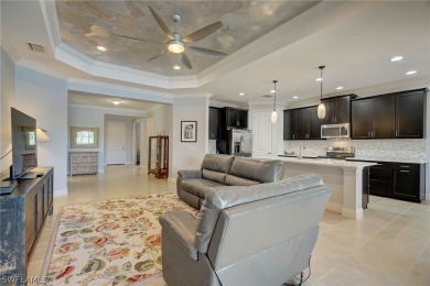 Step into modern elegance with this stunning 3-bedroom plus den on Vanderbilt Country Club in Florida - for sale on GolfHomes.com, golf home, golf lot