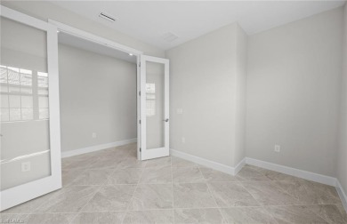 Enjoy low-maintenance, resort-style living in this beautifully on River Hall Country Club in Florida - for sale on GolfHomes.com, golf home, golf lot