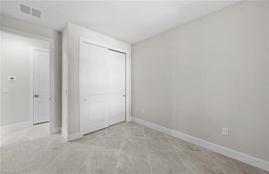 Enjoy low-maintenance, resort-style living in this beautifully on River Hall Country Club in Florida - for sale on GolfHomes.com, golf home, golf lot