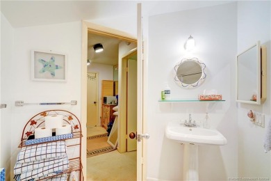 Enjoy breathtaking panoramic views of the golf course and lake on Ocean Club At the Hutchinson Island Beach Resort in Florida - for sale on GolfHomes.com, golf home, golf lot