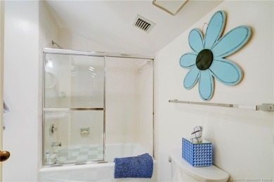 Enjoy breathtaking panoramic views of the golf course and lake on Ocean Club At the Hutchinson Island Beach Resort in Florida - for sale on GolfHomes.com, golf home, golf lot