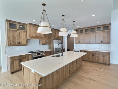 This stunning property features 4 bdrms, 4.5 bathrooms, and an on Teton Reserve in Idaho - for sale on GolfHomes.com, golf home, golf lot