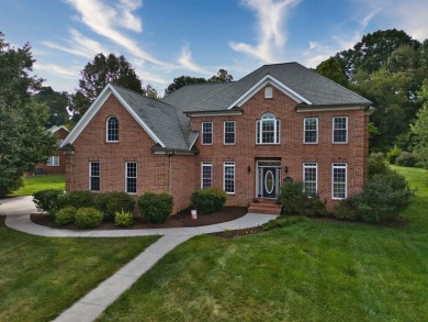 This Stately, all brick colonial is situated on over 1/2 acre on Pete Dye River Course of Virginia Tech in Virginia - for sale on GolfHomes.com, golf home, golf lot