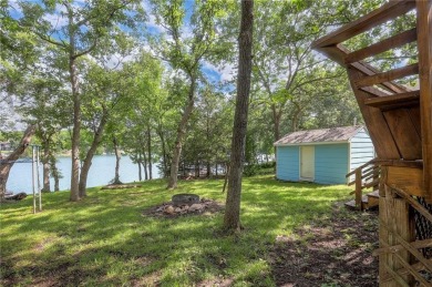 This quaint and charming lakefront bungalow offers a peaceful on Linn Valley Lakes - Deer Trace Golf Course in Kansas - for sale on GolfHomes.com, golf home, golf lot