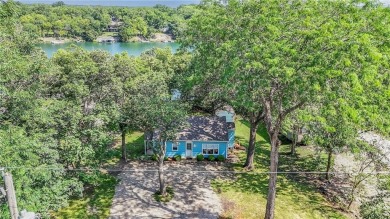 This quaint and charming lakefront bungalow offers a peaceful on Linn Valley Lakes - Deer Trace Golf Course in Kansas - for sale on GolfHomes.com, golf home, golf lot