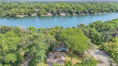 This quaint and charming lakefront bungalow offers a peaceful on Linn Valley Lakes - Deer Trace Golf Course in Kansas - for sale on GolfHomes.com, golf home, golf lot