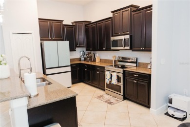 Golf, Gather, and Get Away, Right at Home in ChampionsGate on The Oasis Club at Champions Gate in Florida - for sale on GolfHomes.com, golf home, golf lot