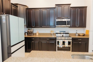 Golf, Gather, and Get Away, Right at Home in ChampionsGate on The Oasis Club at Champions Gate in Florida - for sale on GolfHomes.com, golf home, golf lot