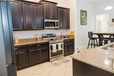 Golf, Gather, and Get Away, Right at Home in ChampionsGate on The Oasis Club at Champions Gate in Florida - for sale on GolfHomes.com, golf home, golf lot