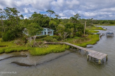 Nestled in a private setting at the end of a cul-de-sac, this on The Country Club of the Crystal Coast in North Carolina - for sale on GolfHomes.com, golf home, golf lot