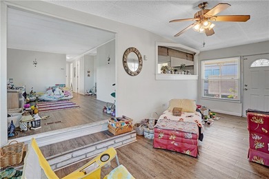 Charming 2/2 with a carport. Features include new windows, rain on Barefoot Bay Golf Course in Florida - for sale on GolfHomes.com, golf home, golf lot