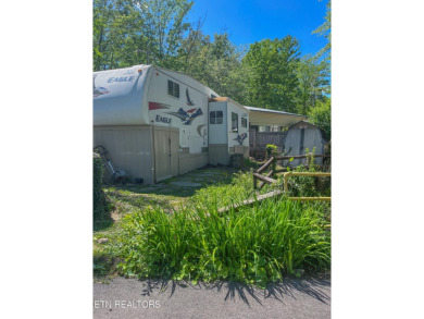 Price improvement!  Motivated sellers!  YOU OWN THE LOT!!  With on Lake Tansi Village Country Club in Tennessee - for sale on GolfHomes.com, golf home, golf lot