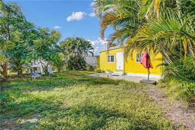 Charming 2/2 with a carport. Features include new windows, rain on Barefoot Bay Golf Course in Florida - for sale on GolfHomes.com, golf home, golf lot
