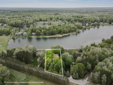 Welcome to your dream home in Canadian Lakes, perfectly situated on Canadian Lakes Country Club-The Royal Course in Michigan - for sale on GolfHomes.com, golf home, golf lot
