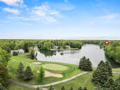 Welcome to your dream home in Canadian Lakes, perfectly situated on Canadian Lakes Country Club-The Royal Course in Michigan - for sale on GolfHomes.com, golf home, golf lot