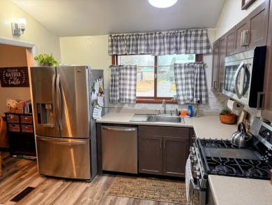 Spacious and beautifully updated duplex featuring 3 bedrooms and on The Oaks At Kincheloe in Michigan - for sale on GolfHomes.com, golf home, golf lot