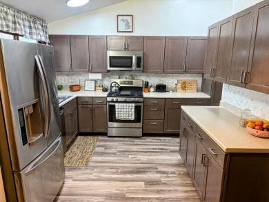 Spacious and beautifully updated duplex featuring 3 bedrooms and on The Oaks At Kincheloe in Michigan - for sale on GolfHomes.com, golf home, golf lot