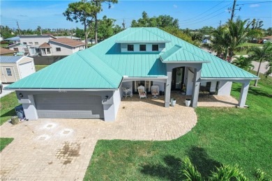 This sounds like a dream home! The high ceiling and metal roof on San Carlos Golf Club in Florida - for sale on GolfHomes.com, golf home, golf lot