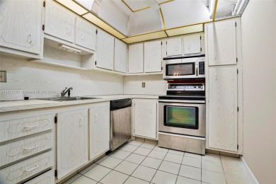 Two-bedroom, two-bathroom condominium. HOA Includes water, trash on Pembroke Lakes Golf Club in Florida - for sale on GolfHomes.com, golf home, golf lot