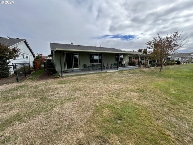 This home features an open floor plan with a view of two golf on Senior Estates Golf and Country Club in Oregon - for sale on GolfHomes.com, golf home, golf lot