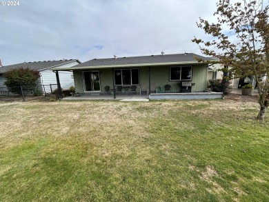 This home features an open floor plan with a view of two golf on Senior Estates Golf and Country Club in Oregon - for sale on GolfHomes.com, golf home, golf lot