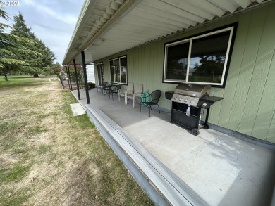 This home features an open floor plan with a view of two golf on Senior Estates Golf and Country Club in Oregon - for sale on GolfHomes.com, golf home, golf lot