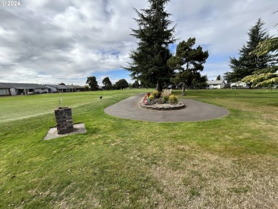 This home features an open floor plan with a view of two golf on Senior Estates Golf and Country Club in Oregon - for sale on GolfHomes.com, golf home, golf lot