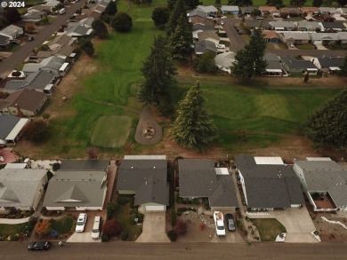 This home features an open floor plan with a view of two golf on Senior Estates Golf and Country Club in Oregon - for sale on GolfHomes.com, golf home, golf lot