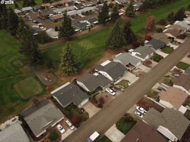 This home features an open floor plan with a view of two golf on Senior Estates Golf and Country Club in Oregon - for sale on GolfHomes.com, golf home, golf lot