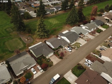 This home features an open floor plan with a view of two golf on Senior Estates Golf and Country Club in Oregon - for sale on GolfHomes.com, golf home, golf lot