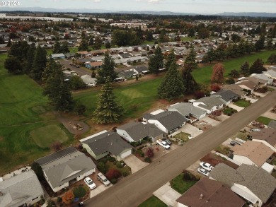 This home features an open floor plan with a view of two golf on Senior Estates Golf and Country Club in Oregon - for sale on GolfHomes.com, golf home, golf lot