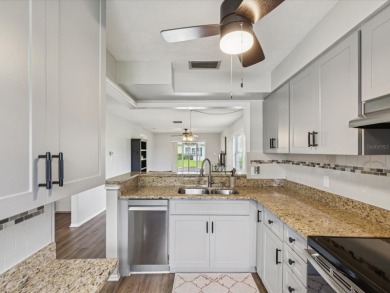 Nestled on the first hole of the Little Course golf course, this on Seven Springs Golf and Country Club in Florida - for sale on GolfHomes.com, golf home, golf lot