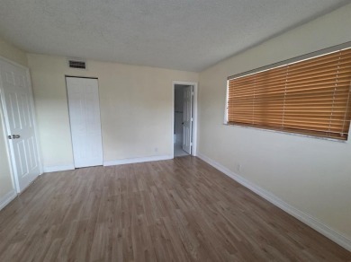 Bright & Spacious Corner Unit with Water Views-Investor on Colony West Country Club in Florida - for sale on GolfHomes.com, golf home, golf lot
