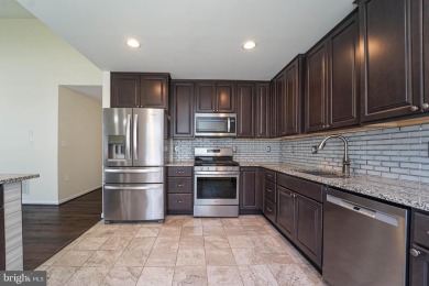 This charming brick and siding single-family home offers the on Heritage Harbour Golf Club in Maryland - for sale on GolfHomes.com, golf home, golf lot