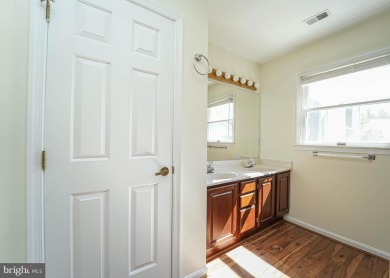 This charming brick and siding single-family home offers the on Heritage Harbour Golf Club in Maryland - for sale on GolfHomes.com, golf home, golf lot