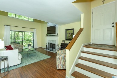 This home sits nestled in a wooded setting and water vista view on Inverness Country Club in Alabama - for sale on GolfHomes.com, golf home, golf lot