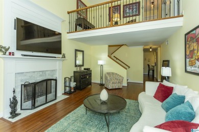 This home sits nestled in a wooded setting and water vista view on Inverness Country Club in Alabama - for sale on GolfHomes.com, golf home, golf lot
