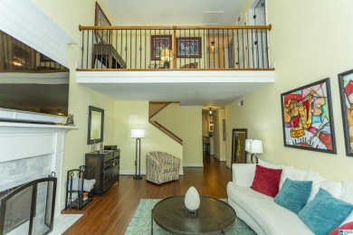 This home sits nestled in a wooded setting and water vista view on Inverness Country Club in Alabama - for sale on GolfHomes.com, golf home, golf lot