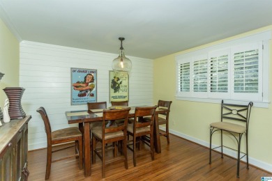 This home sits nestled in a wooded setting and water vista view on Inverness Country Club in Alabama - for sale on GolfHomes.com, golf home, golf lot