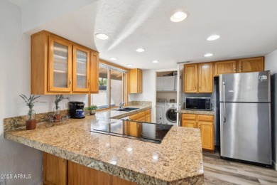 Welcome to this charming 2-bedroom, 2-bathroom townhome located on Bellaire Golf Club in Arizona - for sale on GolfHomes.com, golf home, golf lot