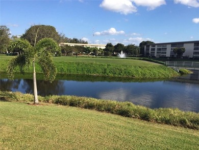Experience luxurious living in this beautifully remodeled open on Wynmoor Golf Course in Florida - for sale on GolfHomes.com, golf home, golf lot