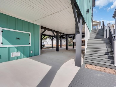 Immaculate 4 bedroom 3.5 bath raised beach home located behind on Prestwick Country Club in South Carolina - for sale on GolfHomes.com, golf home, golf lot