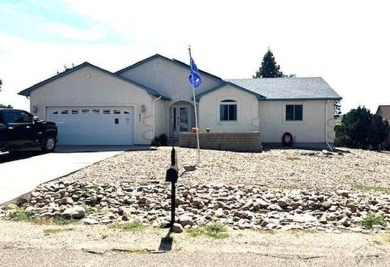 Beautifully landscaped home in the golf course area of Pueblo on Desert Hawk At Pueblo West in Colorado - for sale on GolfHomes.com, golf home, golf lot