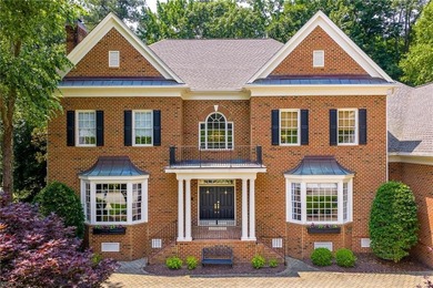 Enjoy refined living in this stately golf-front brick home in on Two Rivers Country Club in Virginia - for sale on GolfHomes.com, golf home, golf lot